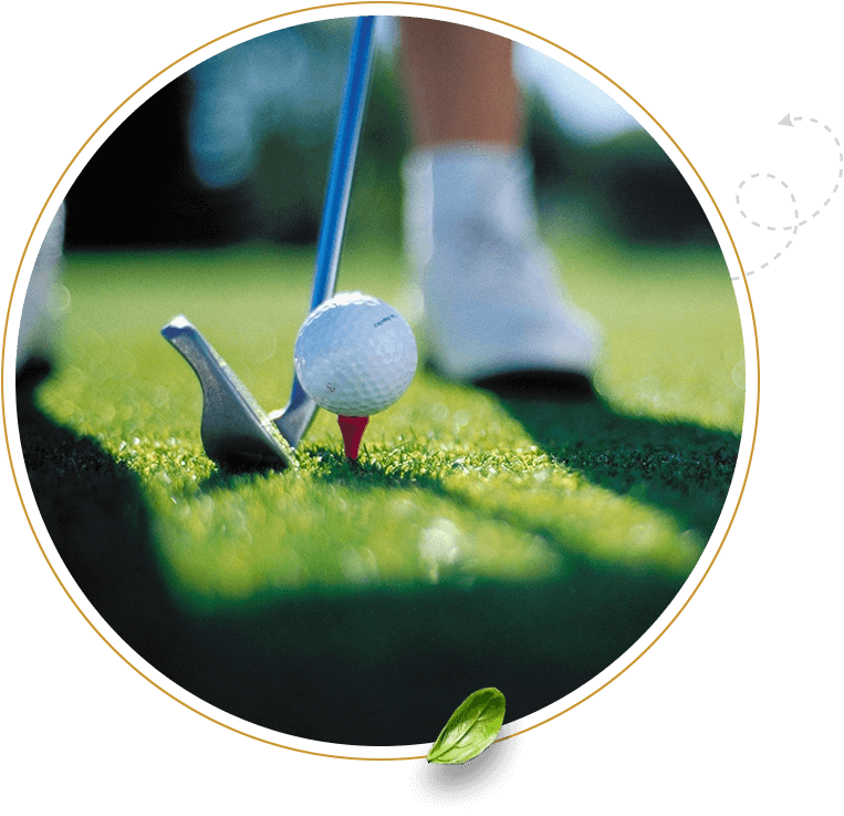 A person holding onto the golf club and putting.